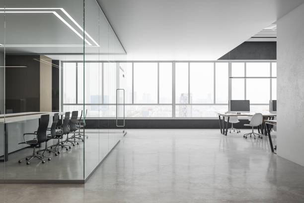 istock Contemporary office interior with computers and meeting table. 1253082716