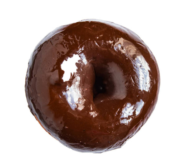 istock One chocolate donut isolated on a white background, top view 1253083951
