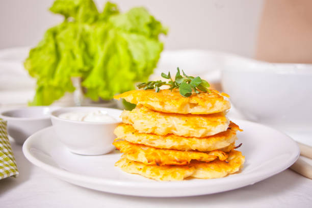 Hash browns potato pancakes draniki on the white plate. Breakfast