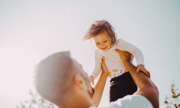 istock The father holds the daughter 1253085981