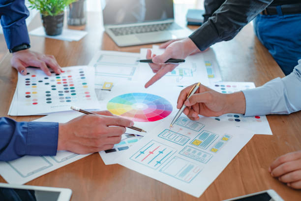 istock Creative web designers and applications work together in the office. 1253087315