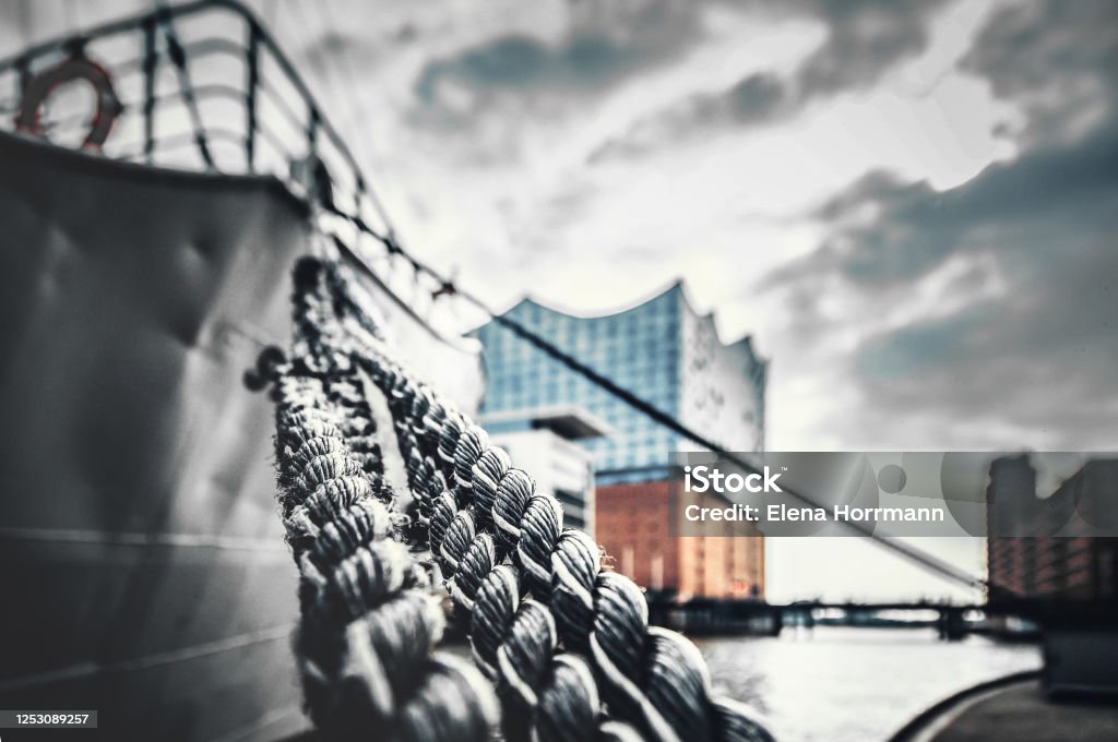 At anchor Ship in front of the Elbphilharmonie Hamburg - Germany Stock Photo