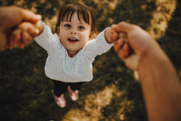 istock The father holds the daughter 1253090386