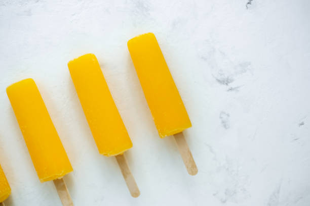 istock Orange fruit ice isolated on a white background. Stick ice cream. 1253090526