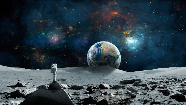 istock Space background. Astronaut standing on moon surface with earth planet and colorful nebula. 1253090850