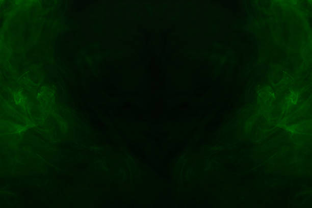 Green steam on a black background. Copy space.
