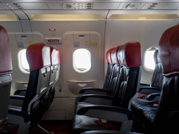 istock Emergency exit window in aircraft cabin. Long leg room seat. premium seat. Emergency exit seat. 1253094617