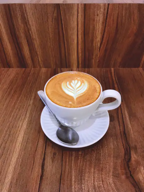 Flatwhite in a white cup and saucer