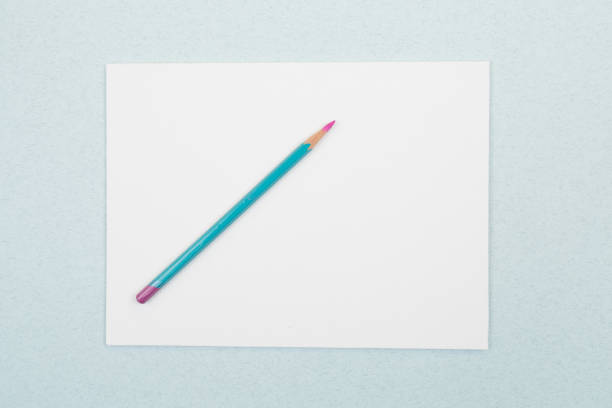 istock a blank sheet with a pencil on a blue background. life with a clean slate 1253095565