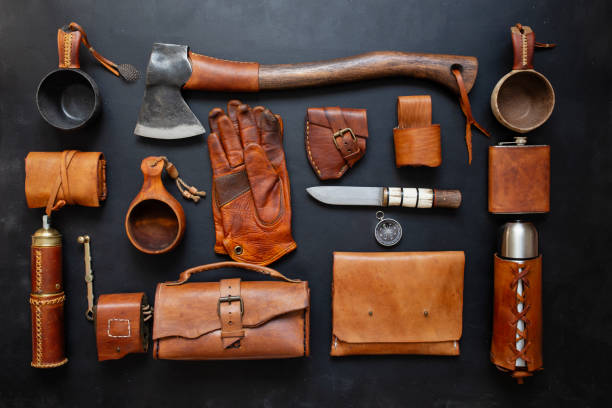 istock bushcraft ax and leather camping equipment 1253098688
