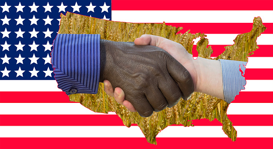 Handshake against USA and China flags background