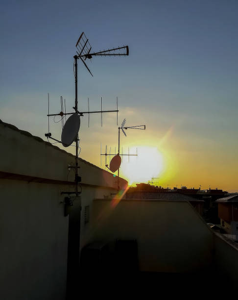 istock View of the sun setting from a terrace with several satellite dishes in Alquerias 1253100352