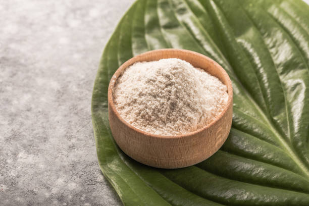 istock Collagen powder over green textured leaf background with copy space. Dietary nutritional supplement 1253106280