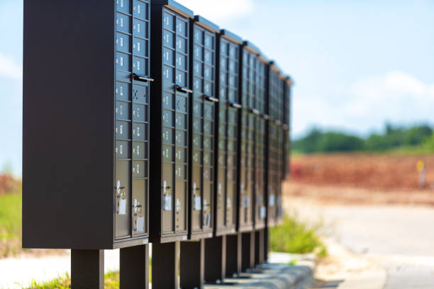 istock Grouping of Mailboxes lined up in a row in a neighborhood under development 1253109956