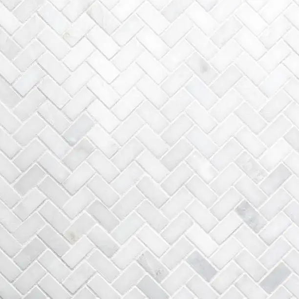 Photo of White Herringbone Marble Mosaic Wall Texture