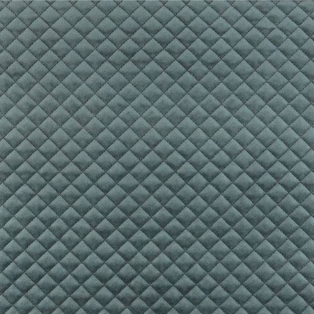 Velvet upholstery quilted fabric texture in charcoal grey Velvet upholstery quilted fabric texture in charcoal grey head board bed blue stock pictures, royalty-free photos & images