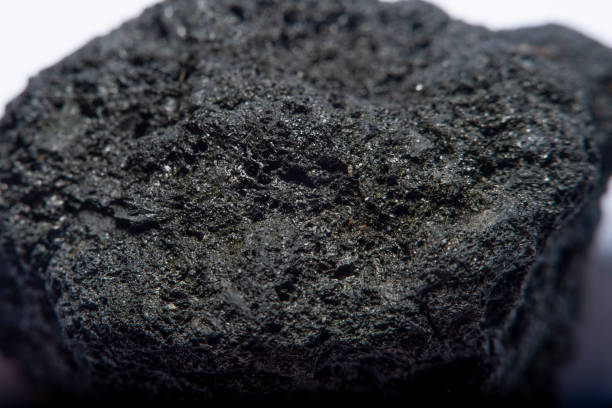 istock Blurred black background in soft focus with hard coal at high magnification 1253113381
