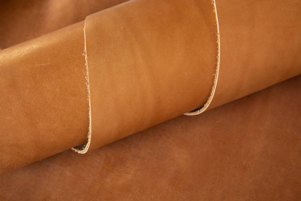 istock Genuine light brown leather twisted in a spiral 1253113852