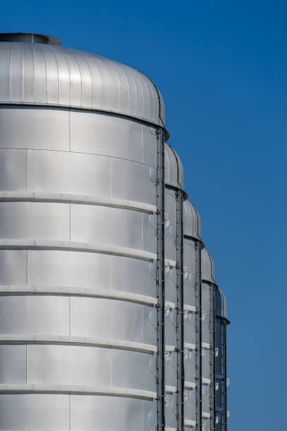 istock Low Angle View Of Factory Against Clear Blue Sky 1253117902