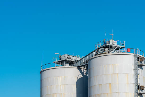 istock Low Angle View Of Factory Against Blue Sky 1253117923