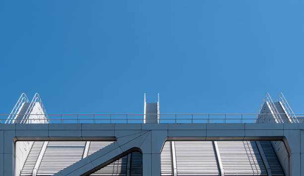 Low Angle View Of Modern Building Against Clear Blue Sky