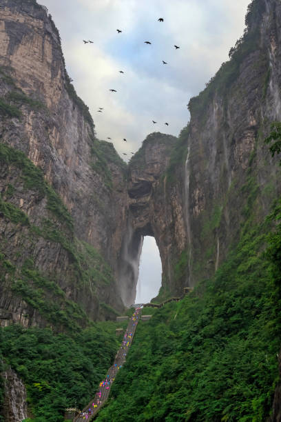 istock Birds flying over Holy Tianmen Mountain 1253125399
