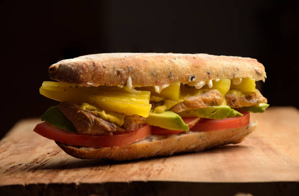 istock Meat sandwich with avocado, tomato, mayo, chilli in a baguette 1253126042