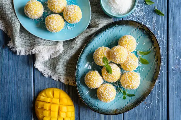 Mango Coconut Ladoo – traditional sweet balls made of mango puree, desiccated coconut and condensed milk