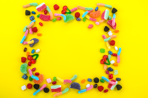 Colorful and happy variety of sweets and candies that are the delight of children and adults forming a frame for posting your messages and photo memories.