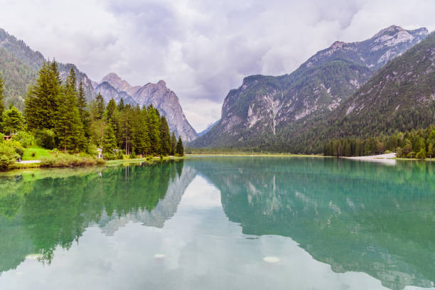 istock Green mountain lake in Dolomites 1253129408