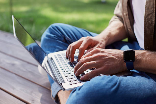 istock Busy man completing his tasks on laptop 1253129529