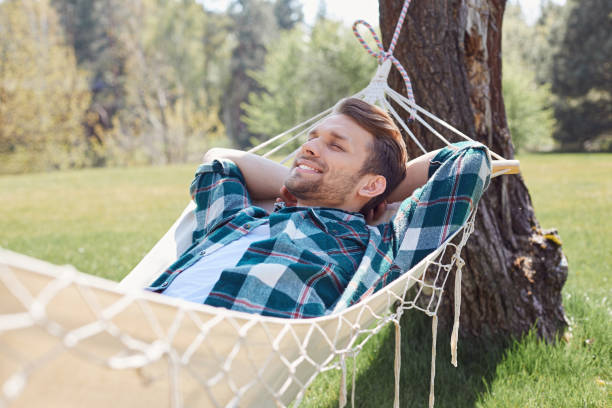 istock Positive man having peaceful rest in nature 1253129531