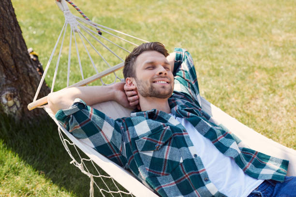 istock Pleased male having a nap in open air 1253129532