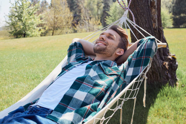 istock Restful positive man enjoying weekend time in nature 1253129555