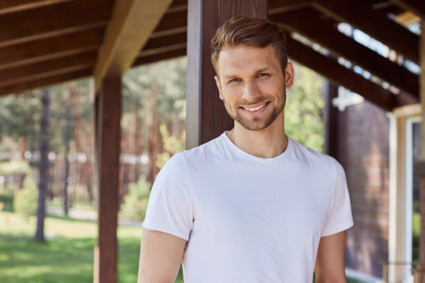 istock Positive bristled man resting outside the town 1253129603