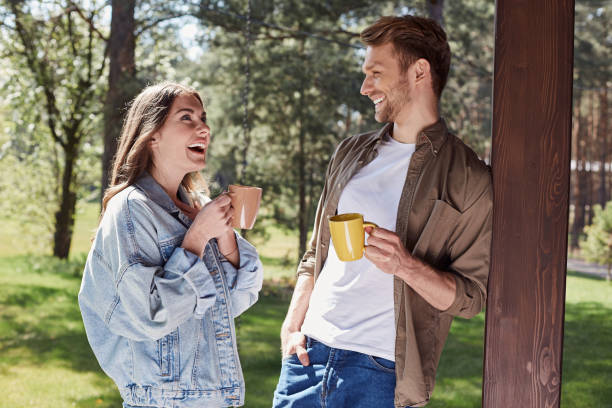 istock Delighted couple having cheerful talk in nature atmosphere 1253129610