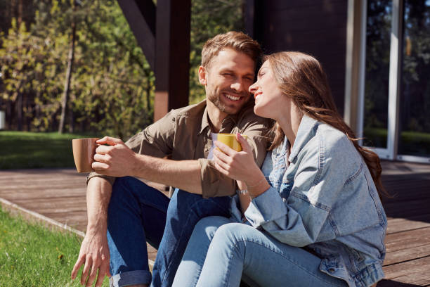 cute man and woman having romantic feelings outdoors - coffee cafe drinking couple imagens e fotografias de stock