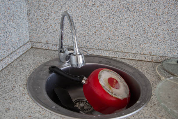 istock Process of cleaning dirty dishes 1253134490