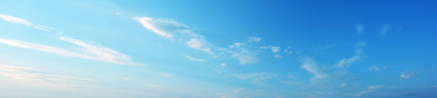 istock Blue sky with white clouds panoramic large shot. Background from the cloudy sky 1253138079