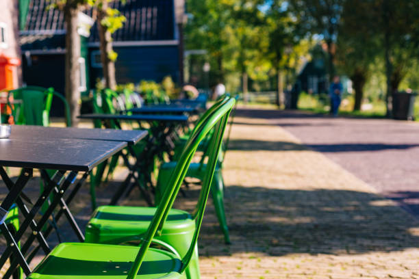 Outdoor restaurant coffee open air cafe green chairs with table. Summer vacation on resort