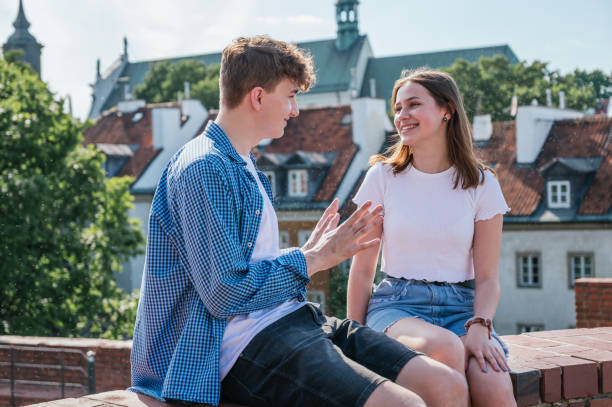 istock Young couple in love talking and smiling 1253144423