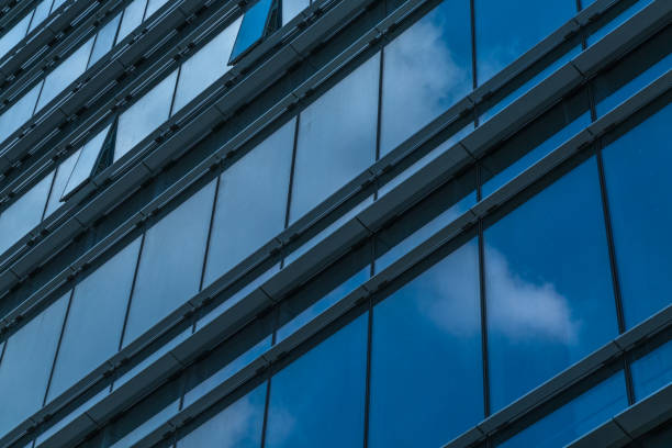 istock Urban abstract - windowed corner of office building 1253148238