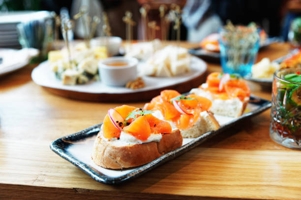 istock Smoked salmon slices and creamy cheese on bread, toned 1253153566