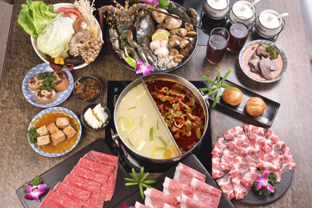 istock Various food served at the table with Chinese hotpot 1253157411