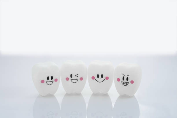 istock Four teeth smile emotion on white background with copy space 1253166843