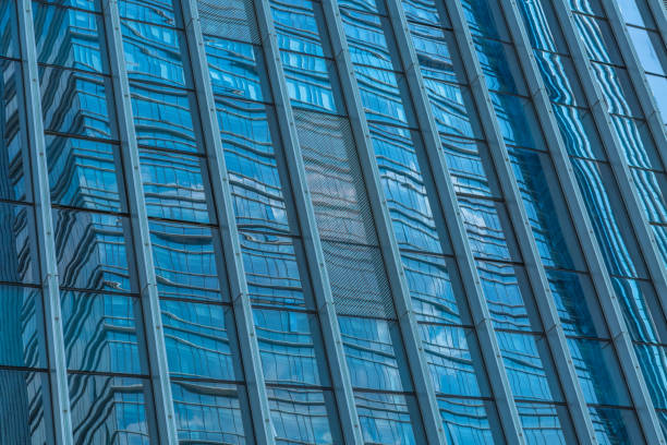 istock Urban abstract - windowed corner of office building 1253167572