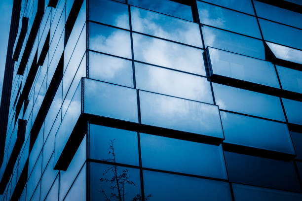 istock Urban abstract - windowed corner of office building 1253168092