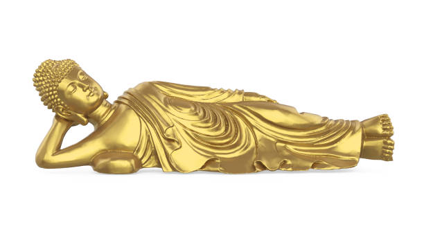 statua del buddha reclinabile d'oro isolata - reclining buddha foto e immagini stock
