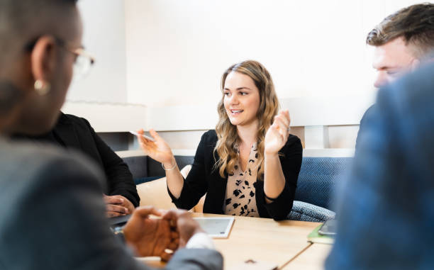 istock Woman taking lead in a meeting. 1253174615