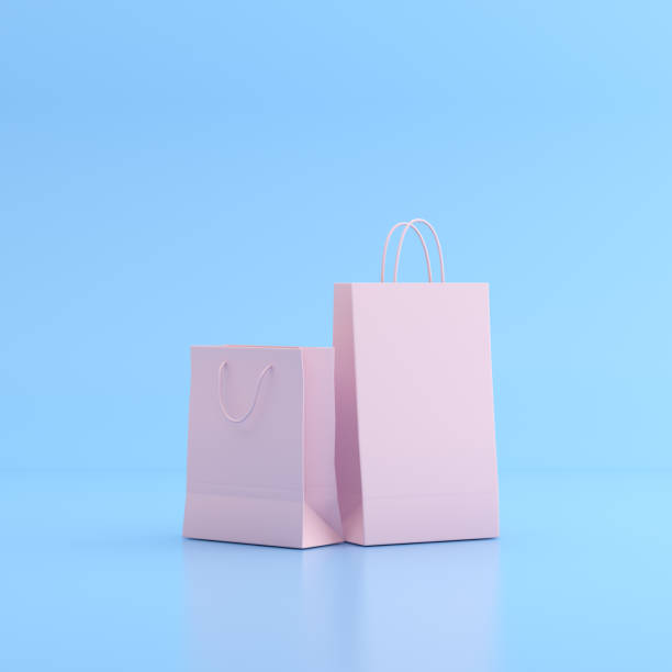 istock Mock up of shopping bags on blue background. 3D render. 1253179532